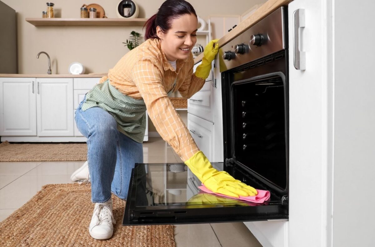 Maid in T.O expert handling oven cleaning in East York, ON with precision and care ensuring high-quality results. Oven Cleaning Near Me