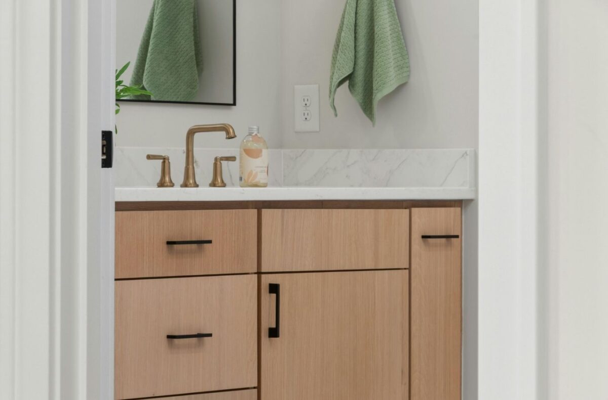Maid in T.O team completing cabinet cleaning in East York home with careful surface wiping and kitchen detailing.